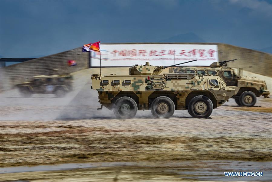 Armored vehicles attend a dynamic display of ground military equipments at the 12th China International Aviation and Aerospace Exhibition (Airshow China) in Zhuhai, south China\'s Guangdong Province, on Nov. 7, 2018. (Xinhua/Yang Guang)