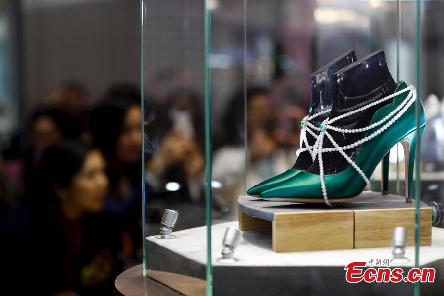 A pair of shoes with jewelries are exhibited at China International Import Expo (CIIE) in Shanghai. (Photo: China News Service/Du Yang)