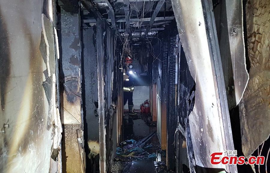 A fire at a low-cost dormitory-style housing facility in central Seoul, South Korea, is put out on Nov. 9, 2018. The fire killed at least seven people and injured 11.  Authorities are investigating possible safety lapses in the building. (Photo providedto China News Service)