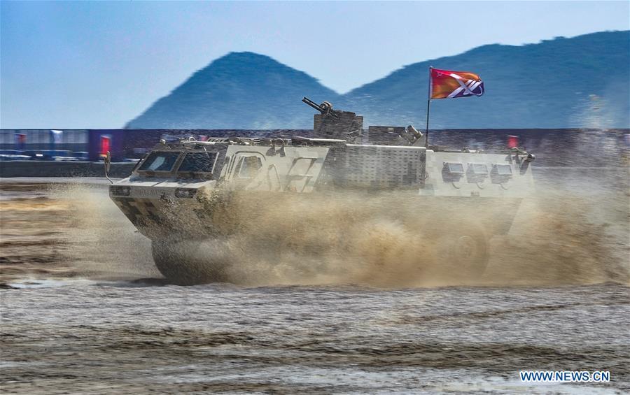 An armored vehicle attends a dynamic display of ground military equipments at the 12th China International Aviation and Aerospace Exhibition (Airshow China) in Zhuhai, south China\'s Guangdong Province, on Nov. 7, 2018. (Xinhua/Yang Guang)