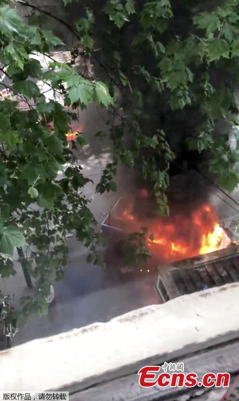 A burning car is seen near the Bourke Street mall, in Melbourne, Australia, November 9, 2018 in this picture grab obtained from social media video. Australian police reported multiple people were hurt after a man set a car on fire and allegedly stabbed a number of people in Melbourne\'s Bourke St. (Photo/Agencies)