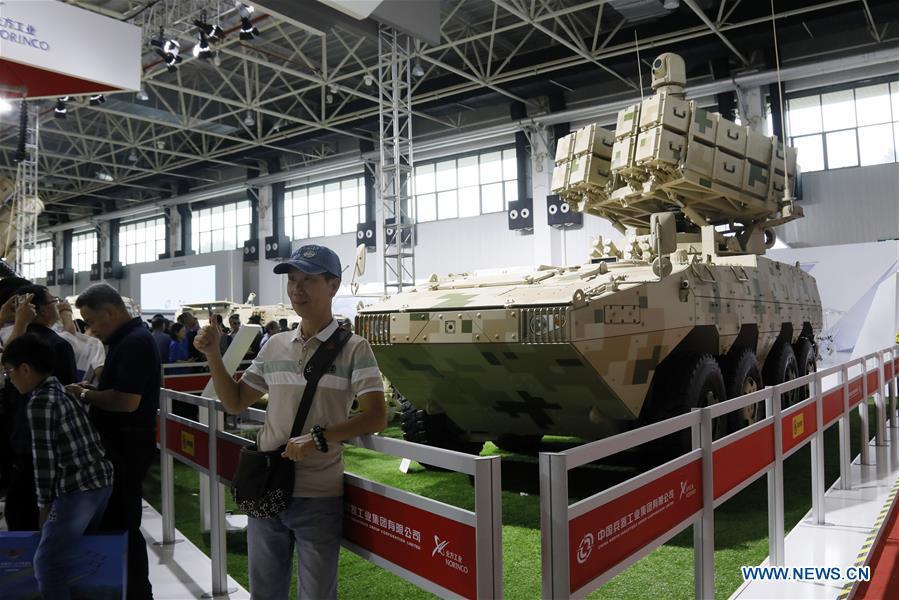 People visit the 12th China International Aviation and Aerospace Exhibition (Airshow China) in Zhuhai, south China\'s Guangdong Province, Nov. 10, 2018. Saturday marks the second of three public days of the Airshow China. (Xinhua/Liu Fang)