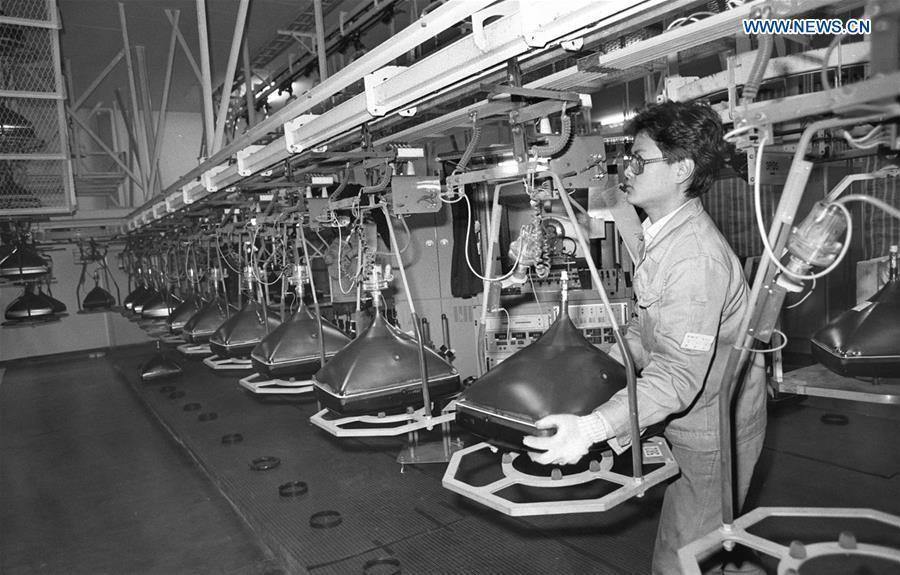 A man works at a factory of Panasonic color television picture tube company jointly run by China and Japan, in this file photo taken in February 1990 in Beijing, capital of China. (Xinhua/Yu Huiru)