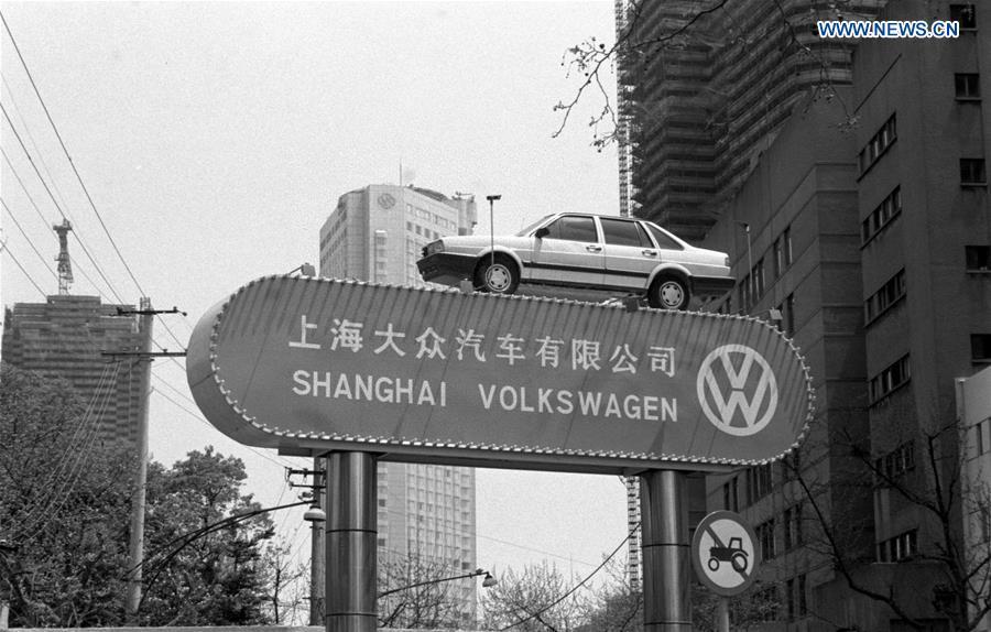A Santana car made by Volkswagen is placed on a sign of Shanghai Volkswagen, a China-Germany joint venture, in this file photo taken in May 1990 in Shanghai, east China. (Xinhua/Xia Daoling)