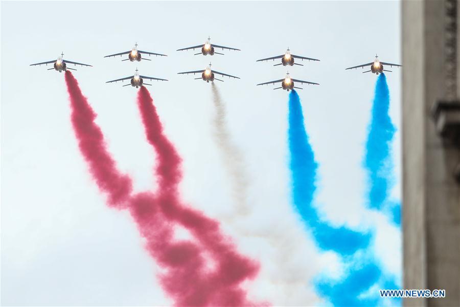 The Patrouille de France aerobatic team fly over the Arc de Triomphe before the ceremony to commemorate the 100th anniversary of the end of World War I in Paris, France, Nov. 11, 2018. (Xinhua/Zheng Huansong)