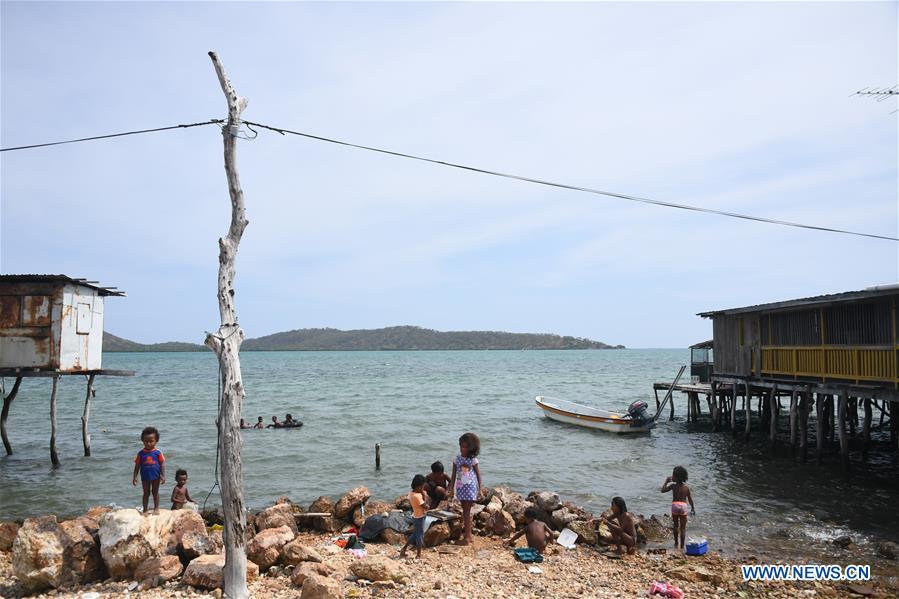Children play on the sea shore in Port Moresby, Papua New Guinea, on Nov. 11, 2018. Leaders from the Asia-Pacific economies are gathering in Port Moresby, the capital of Papua New Guinea for the Asia-Pacific Economic Cooperation (APEC) Leaders\' Week on Nov. 12-18. (Xinhua/Lui Siu Wai)