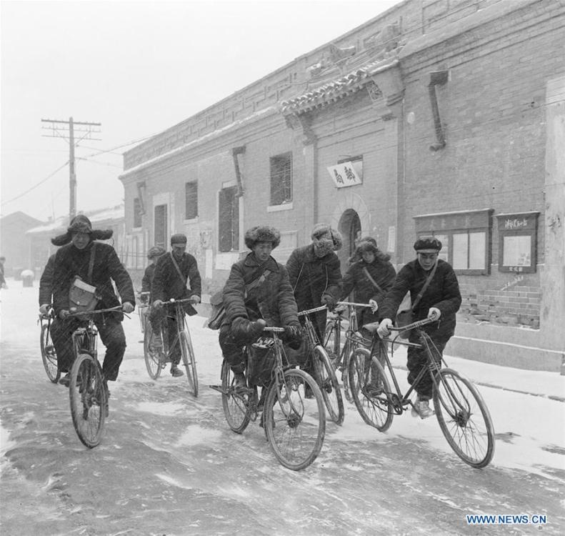 Postmen ride bikes to send newspapers to subscribers in the suburbs of Tianjin, north China, in March, 1956. More than four decades of sound economic growth from 1978, the starting year of the reform and opening-up policy, has fundamentally lifted life quality of 1.3 billion Chinese, who are now able to enjoy the \