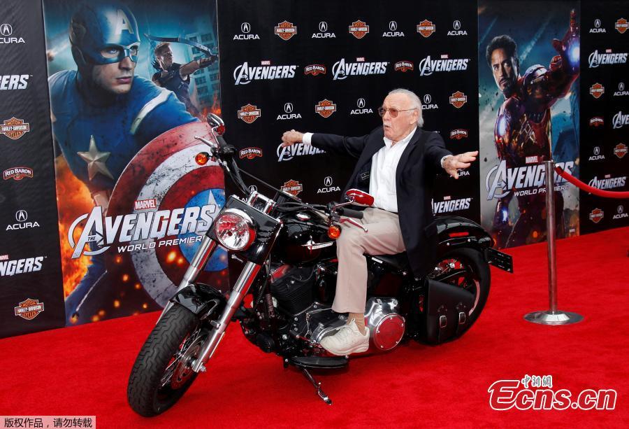 File photo: Comic book creator and executive producer Stan Lee poses on a motorcycle at the world premiere of the film \