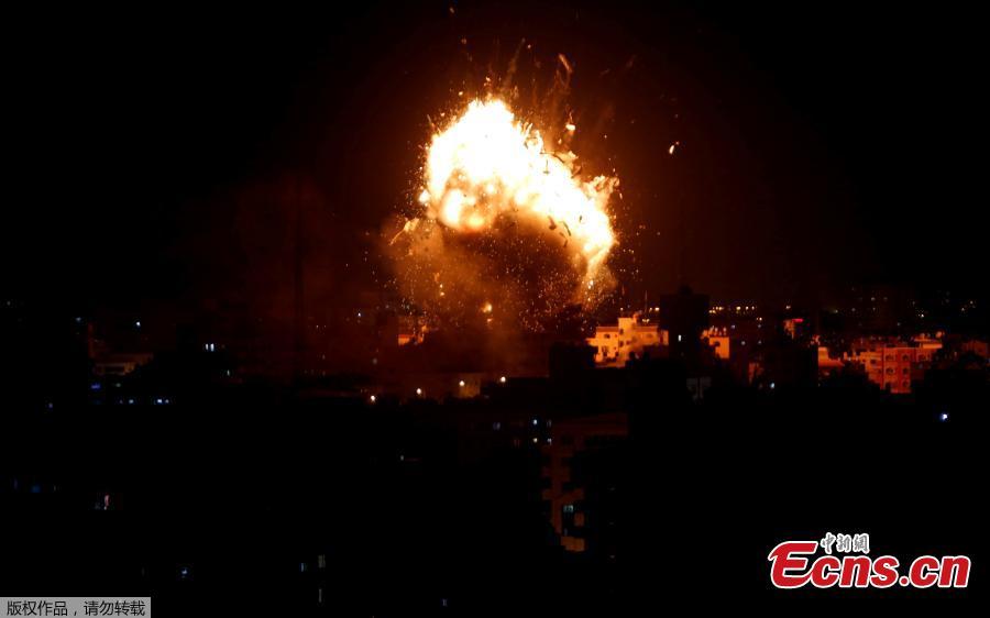 An explosion is seen during an Israeli air strike on Hamas\'s television station, in Gaza City November 12, 2018. (Photo/Agencies)