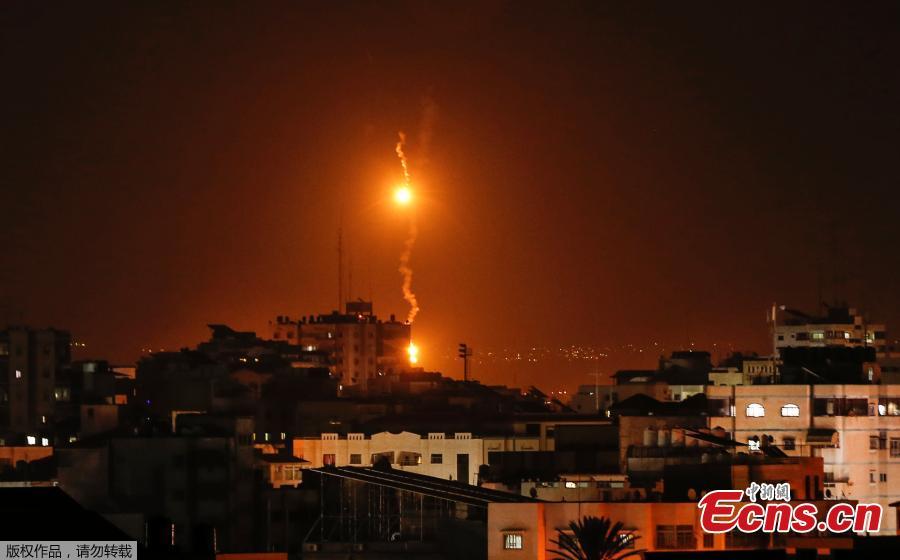 A picture taken on November 12, 2018 shows flares dropped by Israeli warplanes above Gaza city. Israel\'s military said it was carrying out air strikes \