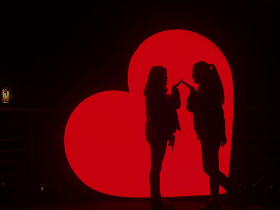 Two visitors take pictures at the \