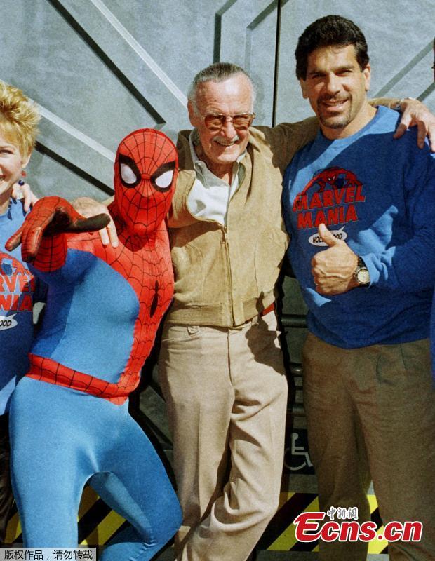 File photo: Marvel Comic Books founder Stan Lee (C) poses with one of his characters \