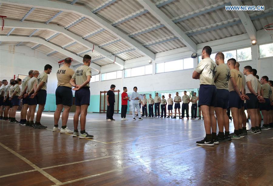 Wing Chun master Zheng Zujie (C-R) shows Wing Chun moves to soldiers of Armed Forces of Malta (AFM) in Luca, Malta, on Nov. 13, 2018. In cooperation with the Malta Martial Arts Association and the local martial arts community, China Cultural Center in Malta invited Zheng Zujie, a martial arts instructor and Wing Chun master from China, to provide Wing Chun Military Fighting Training Course for the AFM on Tuesday. (Xinhua/Yuan Yun)