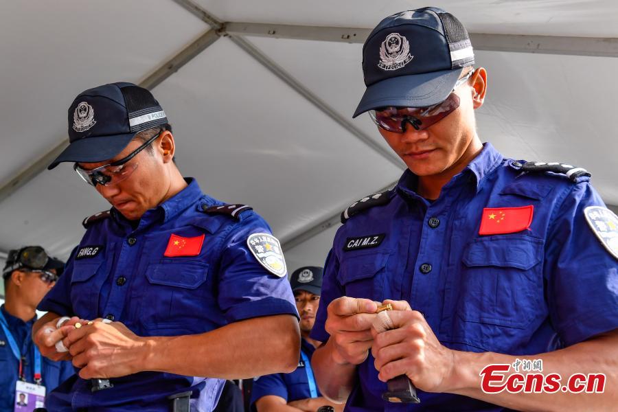 The second USIP World Police Service Pistol Shooting Championship takes place at the Guangdong provincial police training center in Foshan, Guangdong province on November 14, 2018. A total of 256 police from nearly 70 countries and regions across the world registered for the contest. (Photo: China News Service/ Chen Jimin)