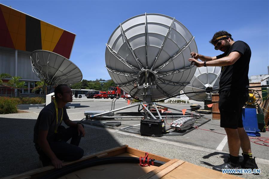 Staff work at the APEC 2018 International Media Centre in Port Moresby, Papua New Guinea (PNG), on Nov. 13, 2018. PNG, comprising about 600 small islands, is the host of the APEC meetings this year. The media centre opened to journalists on Monday and will be in use until Nov. 18. (Xinhua/Lui Siu Wai)