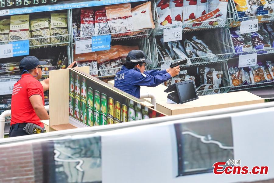 The second USIP World Police Service Pistol Shooting Championship takes place at the Guangdong provincial police training center in Foshan, Guangdong province on November 14, 2018. A total of 256 police from nearly 70 countries and regions across the world registered for the contest. (Photo: China News Service/ Chen Jimin)