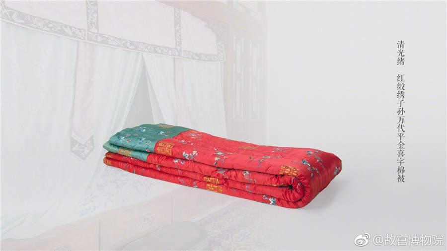 A red satin embroidered quilt decorated with Chinese character \