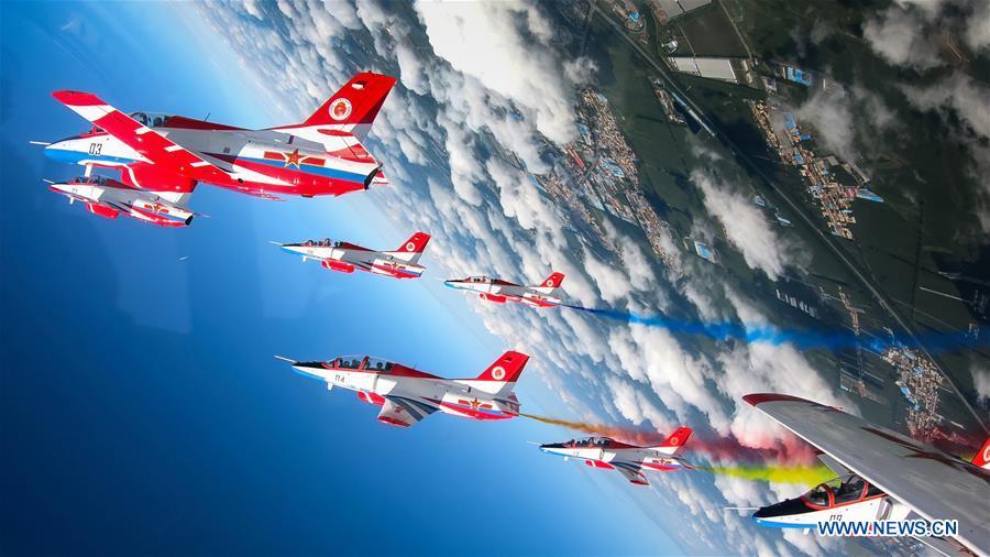 Red Falcon Air Demonstration Team performs during an activity of opening day at the Aviation University of Air Forces in Changchun, capital of northeast China\'s Jilin Province, Aug. 30, 2018. The Chinese Air Force announced a roadmap for building a stronger modern air force in three steps. The building of a stronger modern air force is in line with the overall goal of building national defense and the armed forces, Lieutenant General Xu Anxiang, deputy commander of Chinese Air Force, said at a press conference on celebrating the 69th anniversary of the establishment of Chinese Air Force held in Zhuhai, south China\'s Guangdong Province, Nov. 11, 2018. (Xinhua/Yang Pan)