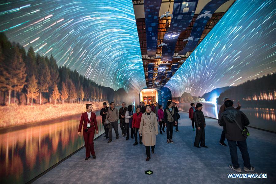 People visit a major exhibition to commemorate the 40th anniversary of China\'s reform and opening-up at the National Museum of China in Beijing, capital of China, Nov. 14, 2018. (Xinhua/Meng Dingbo)