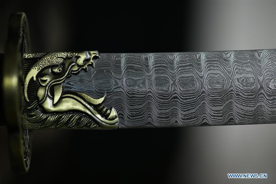 Photo taken on Nov. 14, 2018 shows welded patterns on a decorative sword made by Li Zhujun in Tiejiangzhuang Village of Xingtang County, Shijiazhuang, north China\'s Hebei Province, Nov. 14, 2018. For centuries, Tiejiangzhuang Village has been famed for its skillful blacksmiths and prosperous steel making industry. Li Zhujun is one of the village\'s top steel makers. Based on the skills inherited from his father, Li gained an expertise in the steel-making technique \