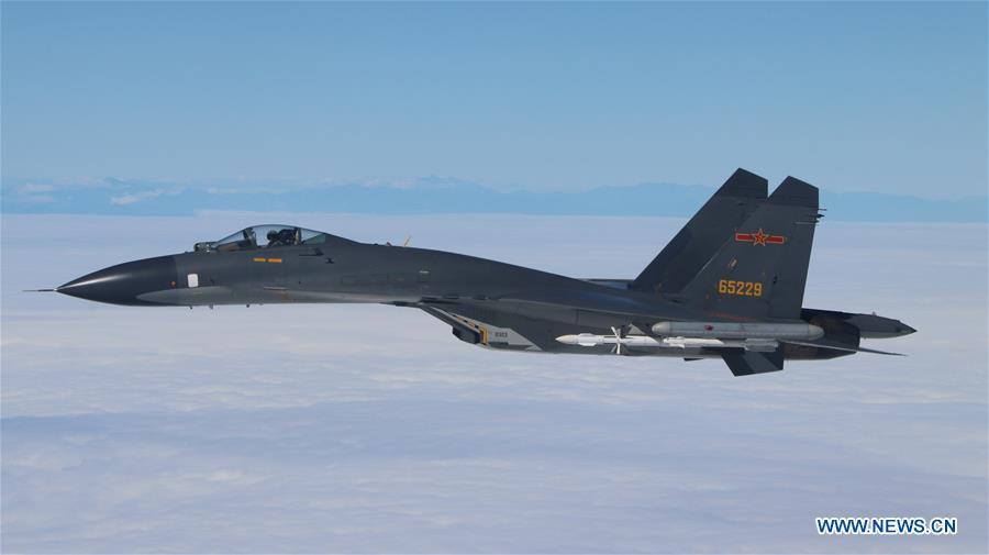 A fighter plane of Chinese air force takes part in a regular patrol exercise on Dec. 11, 2017. The Chinese Air Force announced a roadmap for building a stronger modern air force in three steps. The building of a stronger modern air force is in line with the overall goal of building national defense and the armed forces, Lieutenant General Xu Anxiang, deputy commander of Chinese Air Force, said at a press conference on celebrating the 69th anniversary of the establishment of Chinese Air Force held in Zhuhai, south China\'s Guangdong Province, Nov. 11, 2018. (Xinhua/Shao Jing)