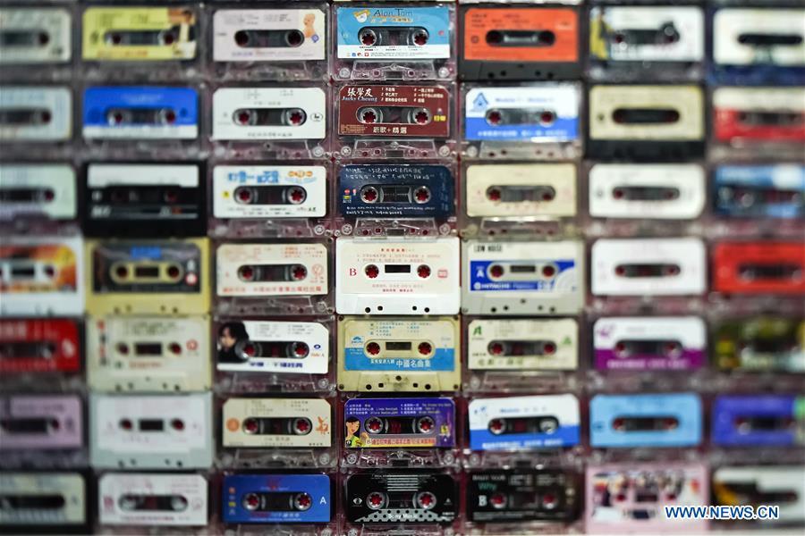 A wall of vintage cassettes is displayed at a major exhibition to commemorate the 40th anniversary of China\'s reform and opening-up at the National Museum of China in Beijing, capital of China, Nov. 15, 2018. Vintage objects are displayed at the exhibition which opened here on Tuesday to show visitors the history, accomplishments, and experience of China\'s reform and opening-up. (Xinhua/Shen Bohan)
