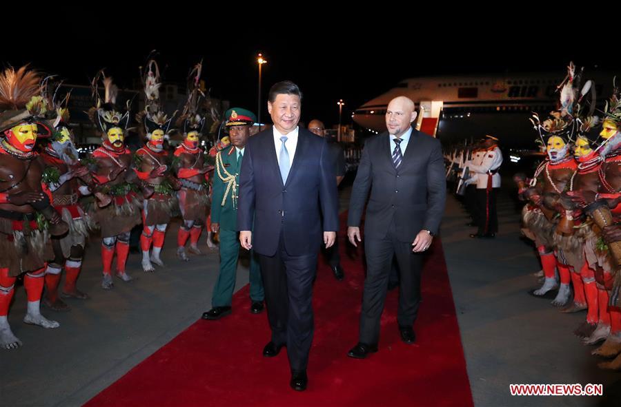 Chinese President Xi Jinping (C) is warmly welcomed by senior Papua New Guinea (PNG) officials and locals upon his arrival at the airport in Port Moresby, PNG, on Nov. 15, 2018. Xi arrived here Thursday to pay a state visit to PNG, meet with leaders of the Pacific island countries which have diplomatic ties with China and attend the 26th Asia-Pacific Economic Cooperation (APEC) Economic Leaders\' Meeting. (Xinhua/Ju Peng)
