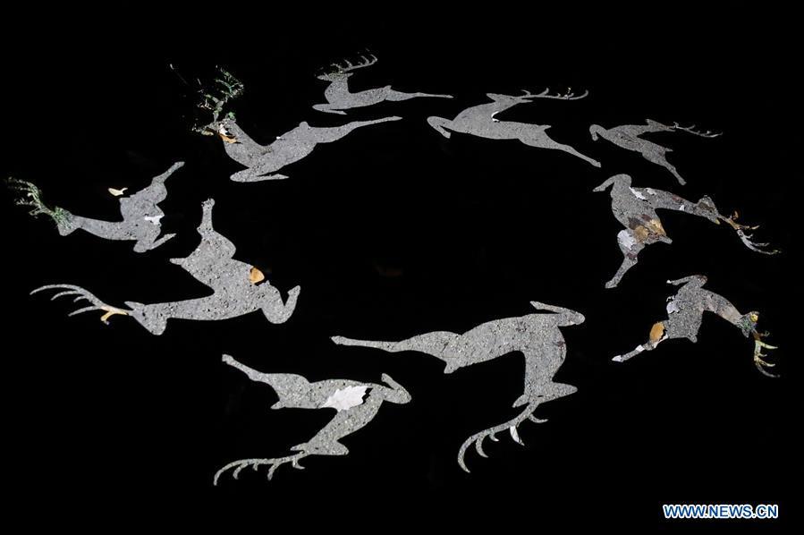 Photo taken on Nov. 15, 2018 shows light decorations projected on the ground during the \