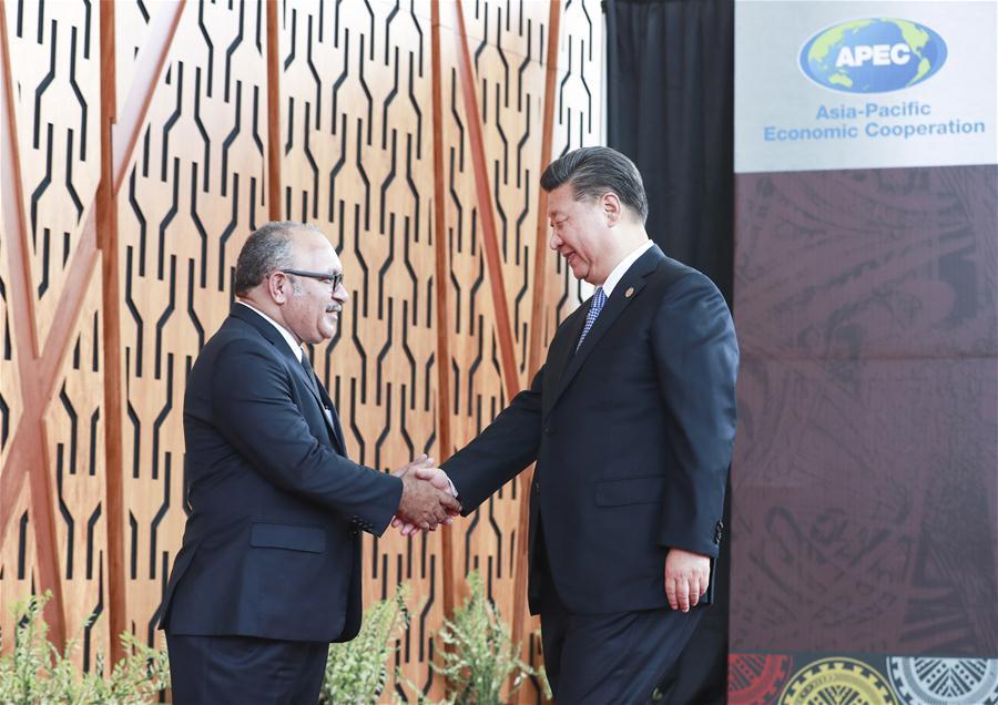 Chinese President Xi Jinping (R) is welcomed by Papua New Guinea (PNG) Prime Minister Peter O\'Neill ahead of a dialogue between APEC leaders and representatives from the APEC Business Advisory Council in Port Moresby, Papua New Guinea, on Nov. 17, 2018. Xi Jinping also delivered a keynote speech titled Jointly Charting a Course Toward a Brighter Future while attending the Asia Pacific Economic Cooperation (APEC) CEO Summit held here on Saturday. (Xinhua/Pang Xinglei)