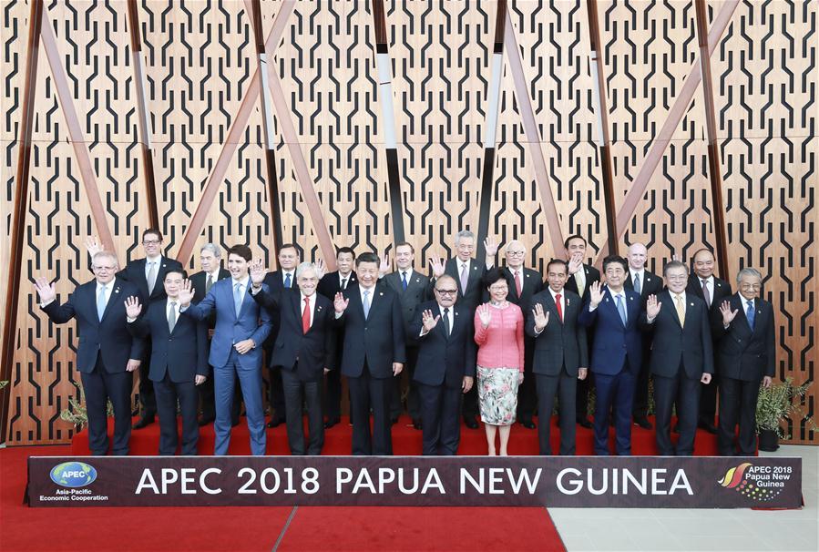 Chinese President Xi Jinping (5th L, front) and other leaders and representatives from member economies of the Asia Pacific Economic Cooperation (APEC) pose for a group photo ahead of a dialogue between APEC leaders and representatives from the APEC Business Advisory Council in Port Moresby, Papua New Guinea, on Nov. 17, 2018. Xi Jinping also delivered a keynote speech titled Jointly Charting a Course Toward a Brighter Future while attending the APEC CEO Summit held here on Saturday. (Xinhua/Pang Xinglei)