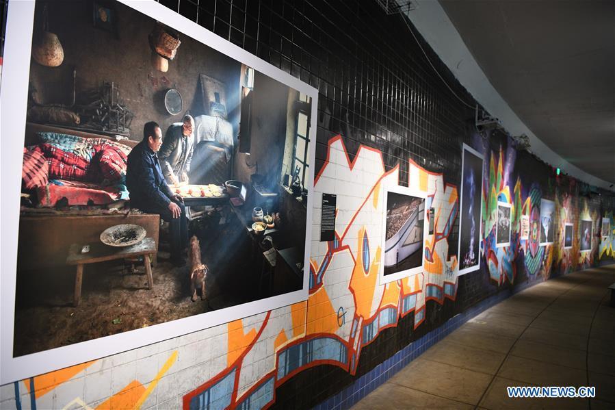 Photo taken on Nov. 19, 2018 shows photographs exhibited at the World Press Photo Exhibition 2018 at Dupont Underground in Washington D.C., the United States. The exhibition, which is held from Oct. 27 to Nov. 25, showcases the winning photographs from the 61st annual World Press Photo contest, which received over 70,000 photographs taken by 4,548 photographers. (Xinhua/Liu Jie)
