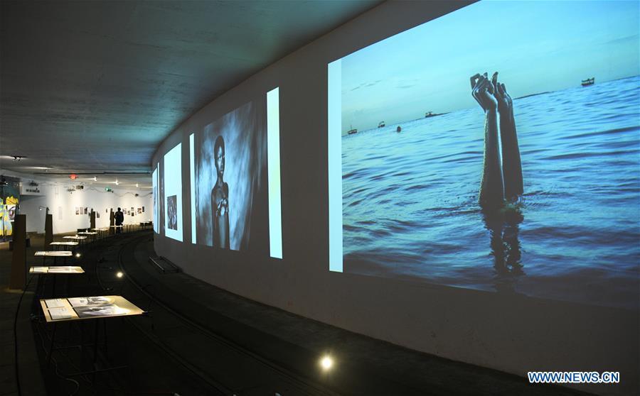 Photo taken on Nov. 19, 2018 shows photographs exhibited at the World Press Photo Exhibition 2018 at Dupont Underground in Washington D.C., the United States. The exhibition, which is held from Oct. 27 to Nov. 25, showcases the winning photographs from the 61st annual World Press Photo contest, which received over 70,000 photographs taken by 4,548 photographers. (Xinhua/Liu Jie)