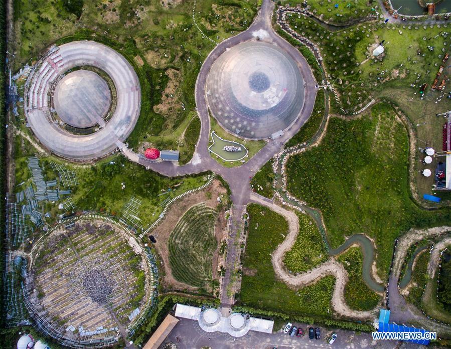 Photo taken on Aug. 1, 2015 shows an aerial view of a space-themed agricultural park hosting a tourism festival for the youth in Tiantai County, east China\'s Zhejiang Province. China is slated to become world\'s largest theme park market by 2020, when the number of tourists is expected to exceed 230 million, according to a fresh report by U.S. engineering firm AECOM. The number of tourists to Chinese theme parks have seen an average annual growth of 13 percent in the past decade, and reached 190 million in 2017. The number is expected to keep the double digit growth in the following years, according to the report. The report attributes the rapid growth to Chinese consumers\' rising income that sparks greater demands on leisure activities, as well as more convenient public transportation systems. (Xinhua/Xu Yu)