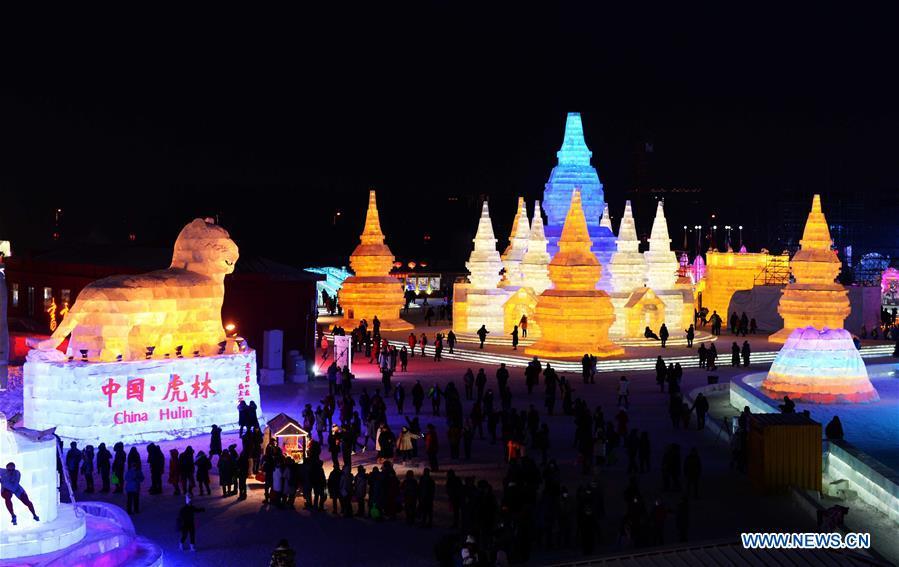 Tourists visit Harbin Ice and Snow World, northeast China\'s Heilongjiang Province, Jan. 5, 2017. China is slated to become world\'s largest theme park market by 2020, when the number of tourists is expected to exceed 230 million, according to a fresh report by U.S. engineering firm AECOM. The number of tourists to Chinese theme parks have seen an average annual growth of 13 percent in the past decade, and reached 190 million in 2017. The number is expected to keep the double digit growth in the following years, according to the report. The report attributes the rapid growth to Chinese consumers\' rising income that sparks greater demands on leisure activities, as well as more convenient public transportation systems. (Xinhua/Wang Kai)