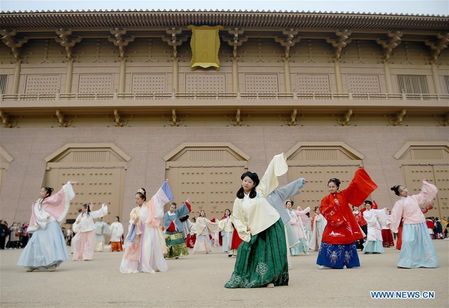 People wearing Hanfu, Chinese traditional costume, perform during an event in front of the Danfeng gate of Daming Palace National Heritage Park in Xi\'an, northwest China\'s Shaanxi Province, Nov. 24, 2018. More than 400 Hanfu lovers attended the event to promote traditional Chinese culture. (Xinhua/Liu Xiao)