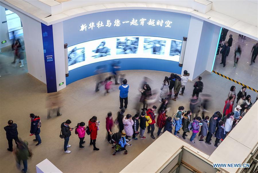 Visitors view photo gallery made by Xinhua News Agency during a major exhibition to commemorate the 40th anniversary of China\'s reform and opening-up at the National Museum of China in Beijing, capital of China, Nov. 24, 2018. (Xinhua/Yin Gang)