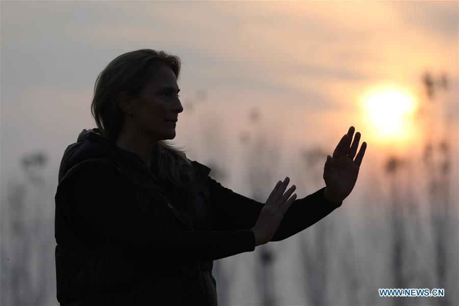Ana Fidalgo practices Taiji in Chenjiagou Village of Wenxian County, central China\'s Henan Province, Nov. 25, 2018. Ana, who comes from Sao Paulo, Brazil, loves Chinese culture, and is a fan of Taiji. It\'s the third time that she comes to Chenjiagou Village to study Taiji. She has taught what she has learned in China in her hometown when coming back to Brazil in recent years, hoping to benefit more people. (Xinhua/Xu Hongxing)