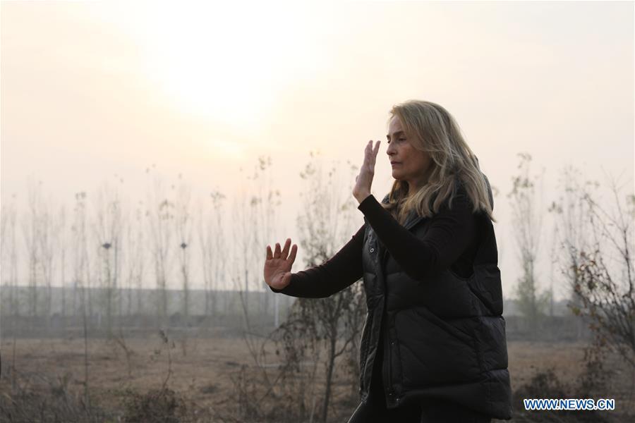 Ana Fidalgo practices Taiji in Chenjiagou Village of Wenxian County, central China\'s Henan Province, Nov. 25, 2018. Ana, who comes from Sao Paulo, Brazil, loves Chinese culture, and is a fan of Taiji. It\'s the third time that she comes to Chenjiagou Village to study Taiji. She has taught what she has learned in China in her hometown when coming back to Brazil in recent years, hoping to benefit more people. (Xinhua/Xu Hongxing)