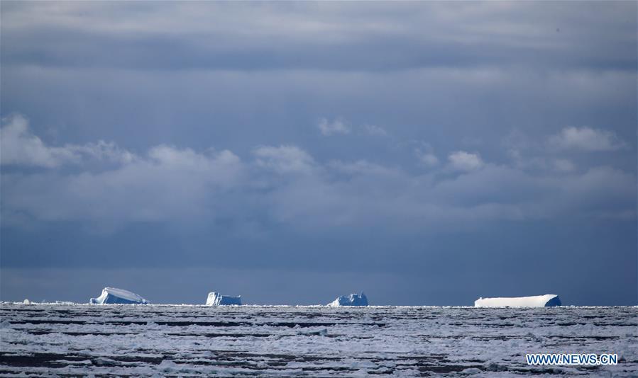 Photo taken on Nov. 26, 2018 shows iceberg seen from China\'s research icebreaker Xuelong in a floating ice area in Southern Ocean. China\'s research icebreaker Xuelong has entered a floating ice area in the Southern Ocean to avoid a cyclone. It is scheduled to reach the Zhongshan Station in Antarctica on Nov. 30. Also known as the Snow Dragon, the icebreaker carrying a research team set sail from Shanghai on Nov. 2, beginning the country\'s 35th Antarctic expedition which will last 162 days and cover 37,000 nautical miles (68,500 km). (Xinhua/Liu Shiping)