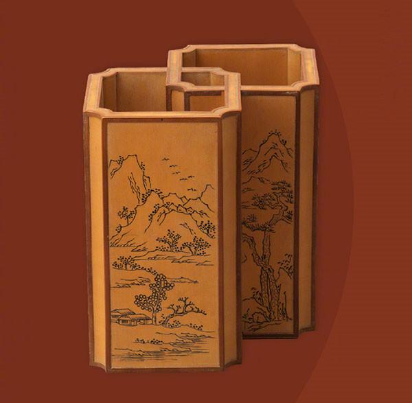 A bamboo paired brush pot engraved with landscape paintings from the Qianlong Period of the Qing Dynasty.  (Photo/Official Weibo account of the Palace Museum)