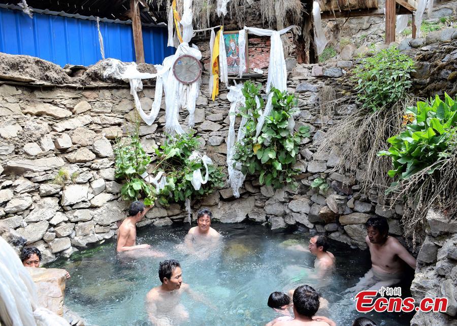 People take a bath in a hot spring, 4590 meters above sea level in Tibet.  The 13th session of the UNESCO Intergovernmental Committee for the Safeguarding of the Intangible Cultural Heritage inscribed Lum medicinal bathing of Sowa Rigpa onto the Representative List of the Intangible Cultural Heritage of Humanity, at a convention held in Port Louis, capital of the Republic of Mauritius, Nov. 28, 2018.(Photo provided by the National Center for the Safeguarding of the Intangible Cultural Heritage in China)