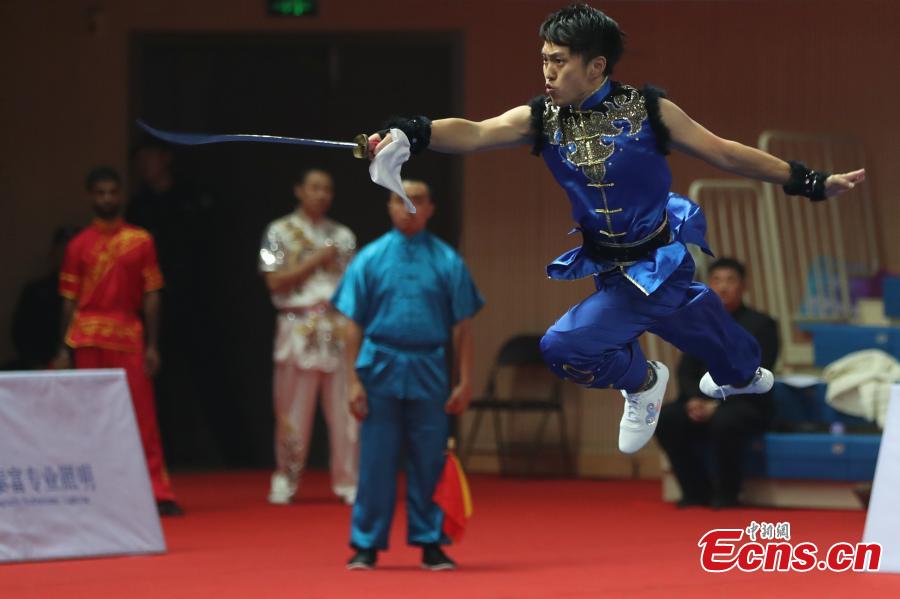 An athlete competes at the first Asian Traditional Wushu (Kungfu) Championship in Nanjing, East China’s Jiangsu province on November 29, 2018. The event attracts athletes from 12 countries and regions including China, Brunei, India, Japan, and Kazakhstan to take part in. (Photo: China News Service/ Yang Bo)
