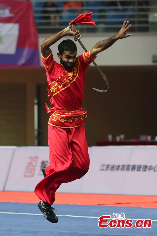 An athlete competes at the first Asian Traditional Wushu (Kungfu) Championship in Nanjing, East China’s Jiangsu province on November 29, 2018. The event attracts athletes from 12 countries and regions including China, Brunei, India, Japan, and Kazakhstan to take part in. (Photo: China News Service/ Yang Bo)