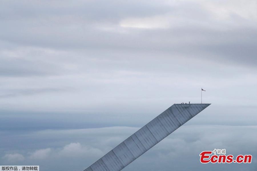 Tourists takes pictures at Holmenkollen Ski Jump in Holmenkollen National Ski Arena in Oslo, Norway November 28, 2018.  (Photo/Agencies)