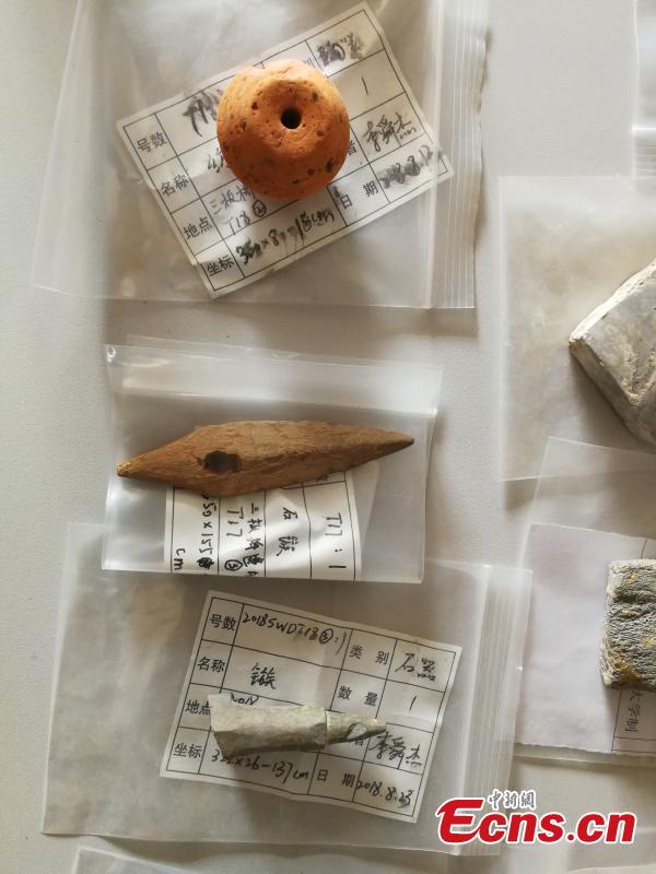 Cultural relics unearthed from historical sites along a trans-provincial water diversion project in Lujiang county, East China’s Anhui province. (Photo: China News Service/ Li Feng)