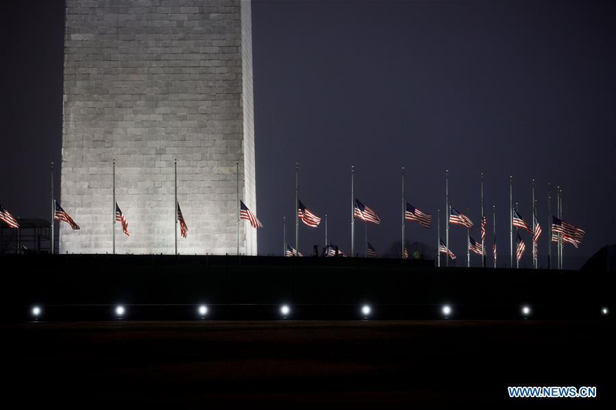 U.S. national flags are seen at half-staff at the Washington Monument in tribute to former U.S. President George H. W. Bush in Washington D.C. Dec. 1, 2018. (Xinhua/Ting Shen)