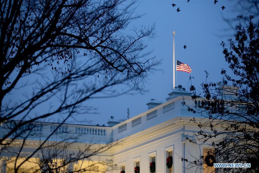 The U.S. national flag flies at half-staff at the White House in tribute to former U.S. President George H. W. Bush in Washington D.C. Dec. 1, 2018. (Xinhua/Ting Shen)