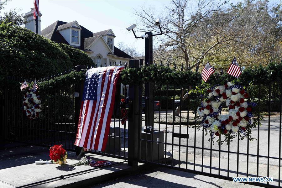 Flowers are seen presented at the gate of the residence of former U.S. President George H.W. Bush to commemorate his death in Houston, Texas, the United States, on Dec. 1, 2018. George H.W. Bush, the 41st president of the United States, has died Friday at the age of 94, according to a statement from his office. (Xinhua/Steven Song)