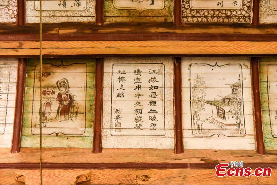 Ancient paintings in an ancestral hall in Sanxi village, Heyuan town, Suichuan county, Ji\'an city, Jiangxi province, on Dec 1, 2018. There is an ancestral hall in Sanxi village, Ji\'an city of Jiangxi province, where exquisite ancient calligraphy and paintings have remained preserved. The hall was built in 1826, during the reign of Emperor Daoguang in the Qing Dynasty (1644-1911). There are more than 120 calligraphy pieces and paintings in the meticulous gongbi style on the caisson and ceiling of the ancestral hall. These paintings feature figures, landscapes, flowers, birds, insects and fish, as well as folk tales and illustrated poems.(Photo: China News Service/ Xiao Yuanpan)