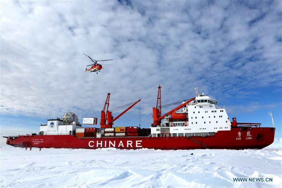 Members of the research team use the helicopter to unload cargo at the roadstead off the Zhongshan station in Antarctica, Dec. 1, 2018. China\'s research icebreaker Xuelong arrived at the roadstead off the Zhongshan station in Antarctica on Saturday. Unloading work has been carried out. Xuelong carrying a research team set sail from Shanghai on Nov. 2, beginning the country\'s 35th Antarctic expedition. (Xinhua/Liu Shiping)